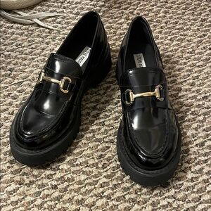 Steve Madden Glossy Black Loafers with Gold Accent